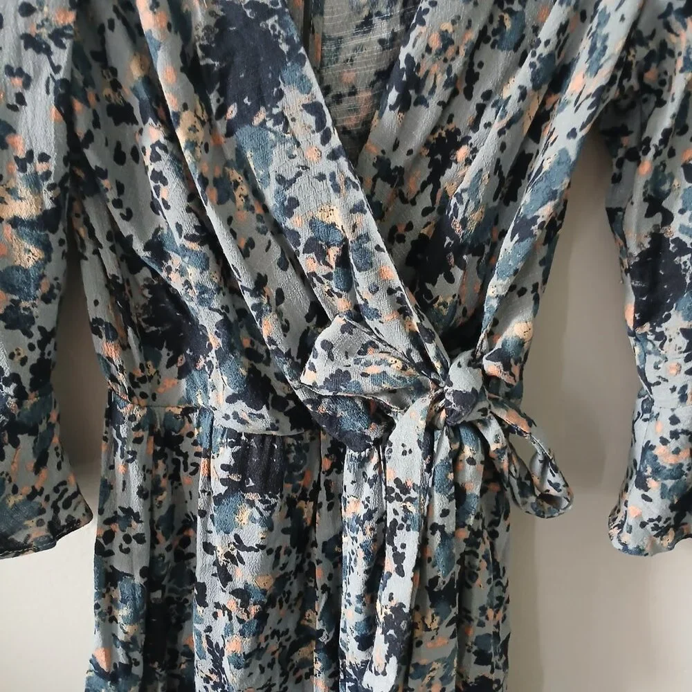 Free People Size S All the Right Ruffles Blue Floral Romper Flutter Sleeve Vneck